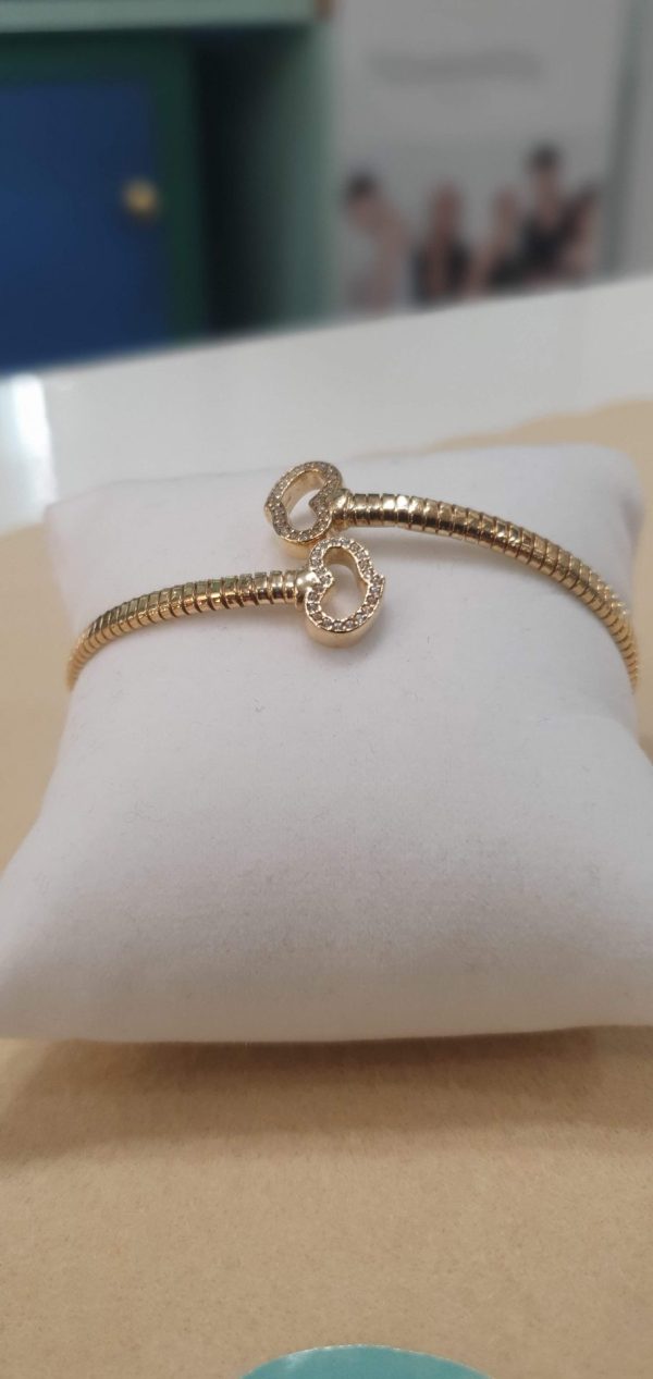 Bracciale rigido con cuori in argento